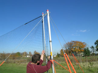 Tightening top cable on Defender litter fence