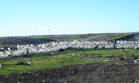 The DEFENDER litter fencing is shown stopping litter from a neighboring farm in California.